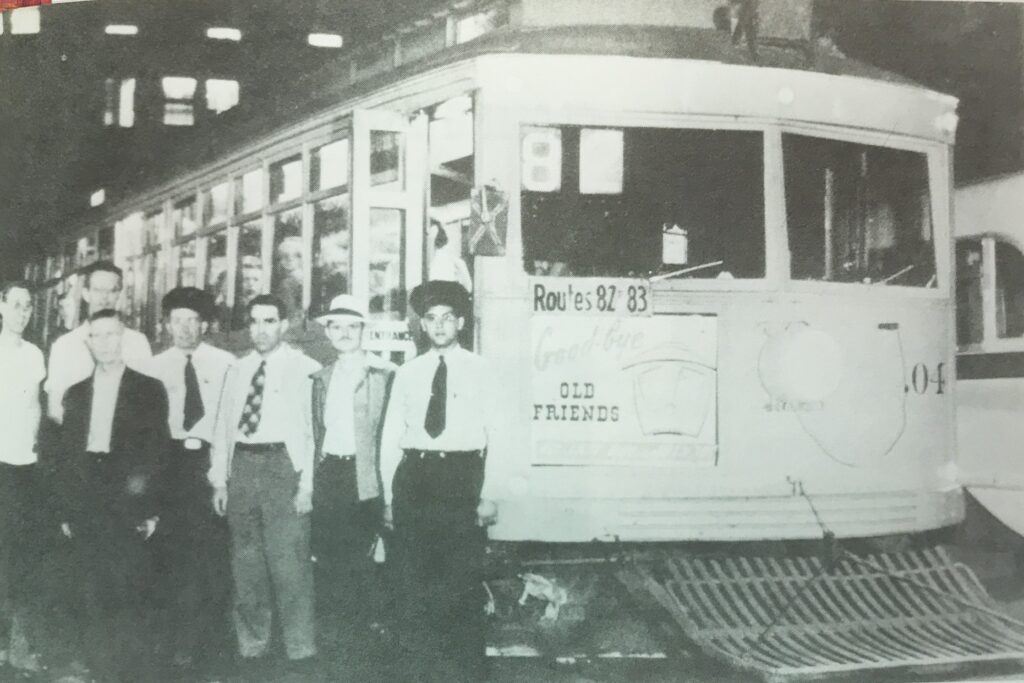 employees standing in front of trolley .04 after its last run